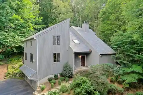 Modern Comfort Enveloped by Wooded Privacy