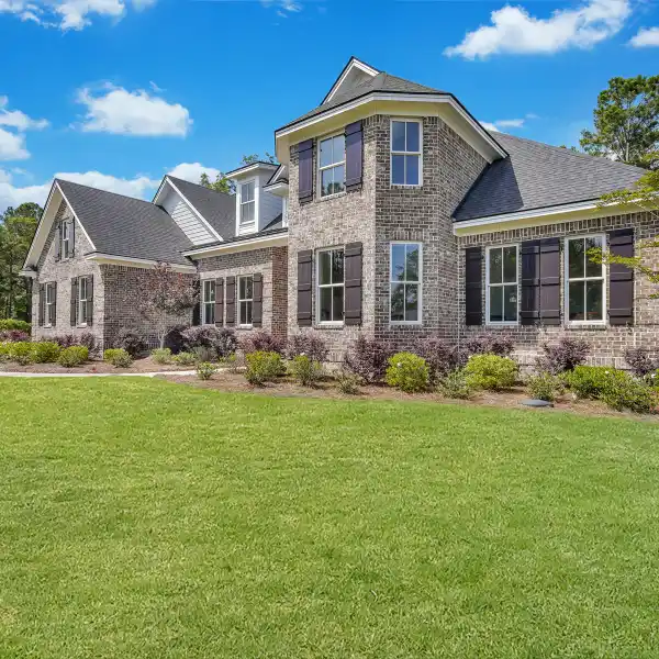 STUNNING BRICK HOME WITH CUSTOM DETAILS, SERENE VIEWS, AND UNFINISHED BONUS SPACE