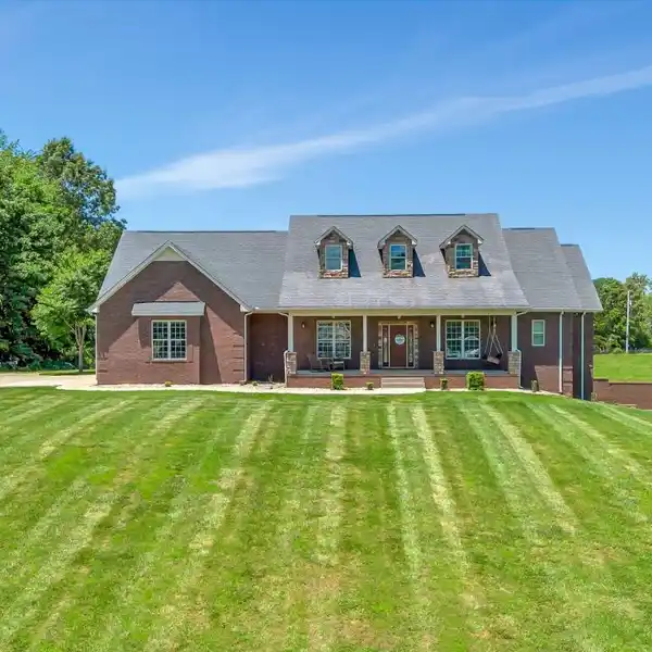 PRIVATE CUSTOM-BUILT HOME ON ACRES OF SERENE LAND