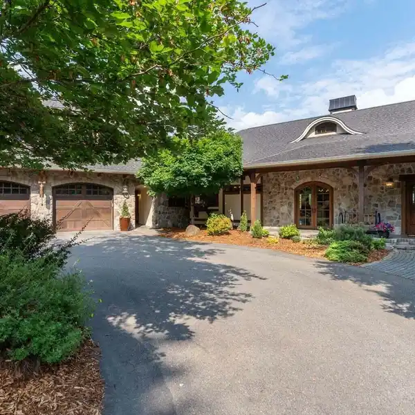 TWO HOMES, ONE SPECTACULAR ESTATE: 9.39 ACRES OVERLOOKING HAYDEN LAKE