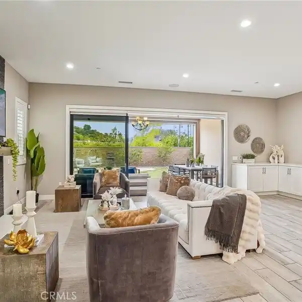 SOPHISTICATED GATED RESIDENCE WITH RESORT-STYLE OUTDOOR LIVING