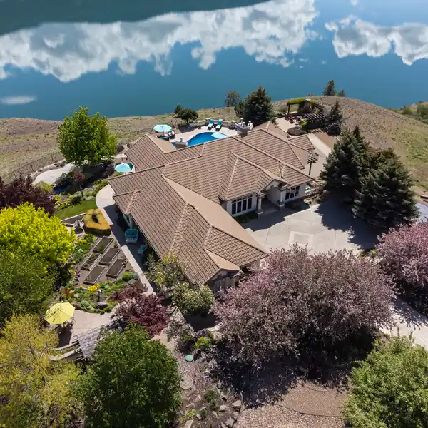 SPRAWLING PROPERTY WITH 180-DEGREE LAKE VIEWS