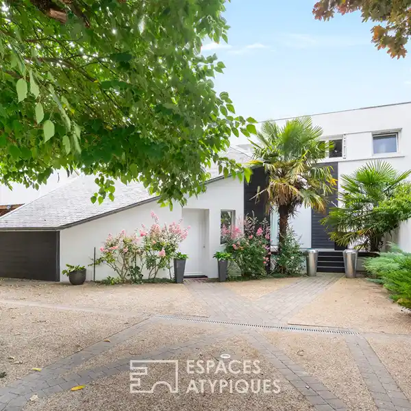 ARCHITECT-DESIGNED HAVEN SURROUNDED BY LUSH GARDEN