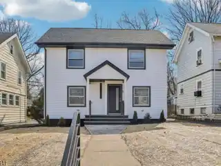 Charming Expanded Colonial Home