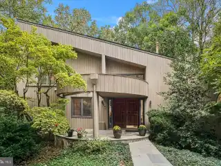Nestled Among Mature Trees on a Beautifully Landscaped Corner Lot