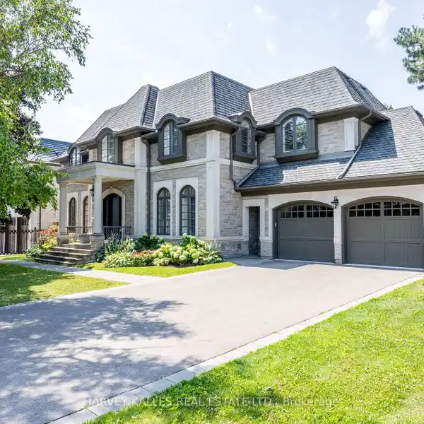INDIANA LIMESTONE SHOWPIECE WITH DESIGNER INTERIORS & 4-CAR GARAGE