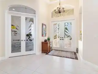 Custom Home on a Lush Private Acre in Bay Hill Estates