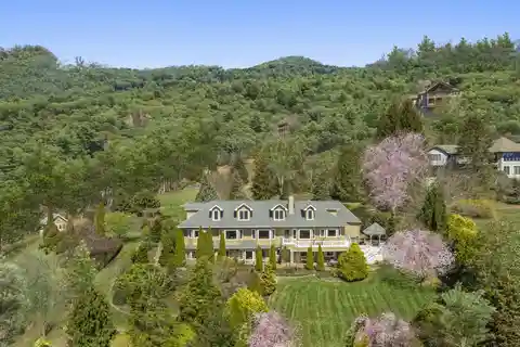 Exquisite English-style Country Estate Overlooking Laurel Ridge Country Club