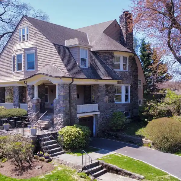 PROMINENT SHINGLE STYLE HOME STEEPED IN HISTORY
