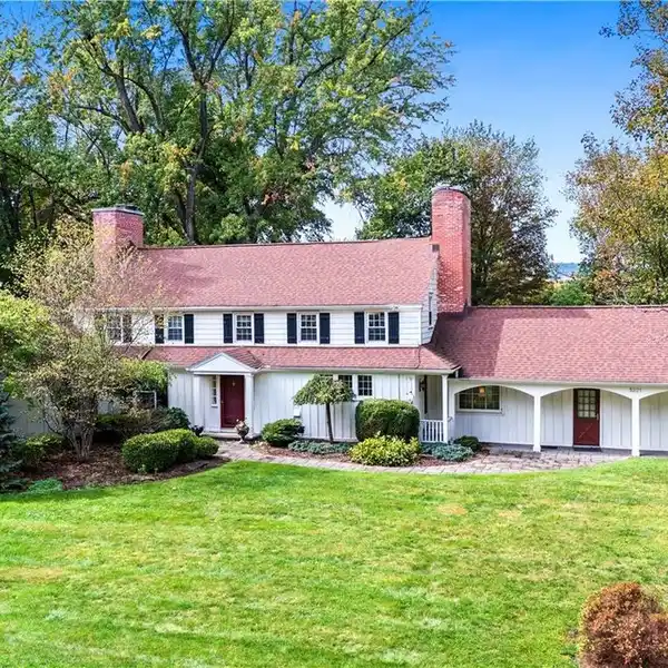 ELEGANT COLONIAL HOME ON A SPACIOUS LOT