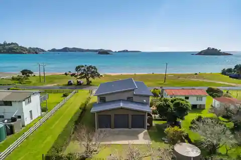 Coastal Paradise Steps from Golden Sands