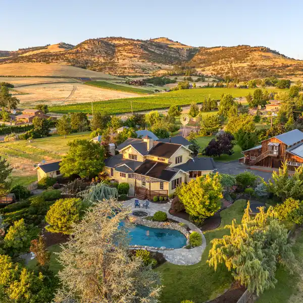 CUSTOM FARMHOUSE-STYLE HOME ON 34 ACRES