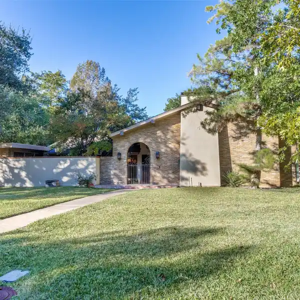 CUSTOM BEAUTY ON A TREED CORNER LOT