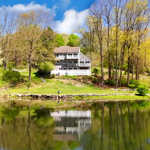 MODERN ELEGANCE MEETS NATURAL SERENITY IN PRESTIGIOUS BEDFORD CORNERS