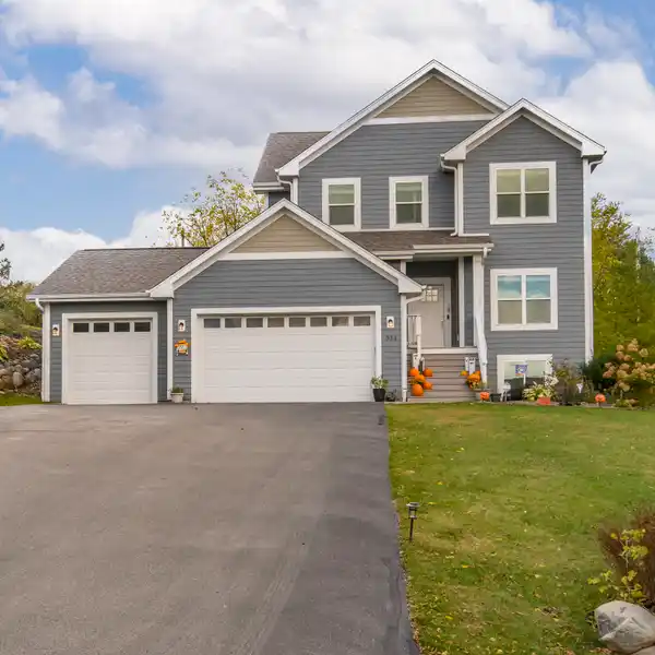 CHARMING TWO-STORY HOME WITH AMPLE STORAGE