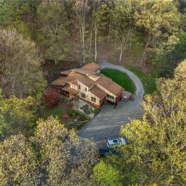 CONTEMPORARY HOME ON 34 WOODED ACRES