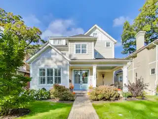 Welcoming Front Porch with Stunning Blue Double Doors