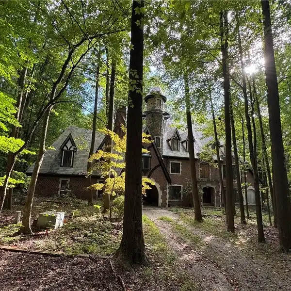 CUSTOM ALL-BRICK TUDOR ON OVER 20 ACRES
