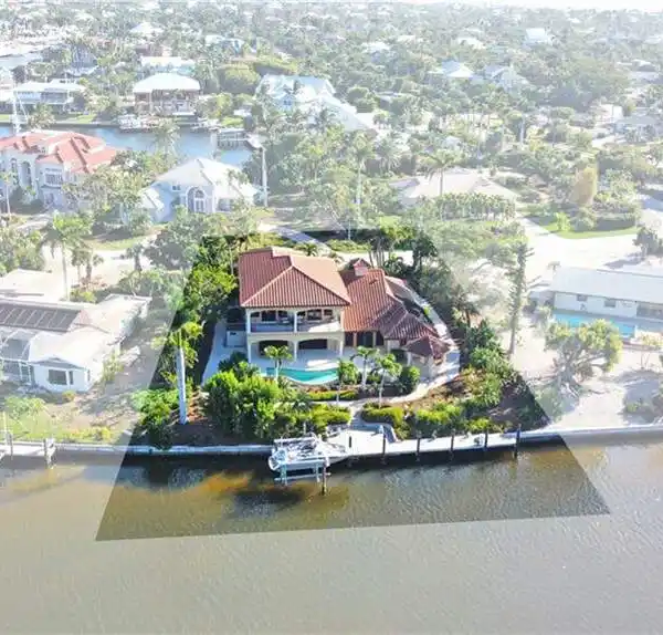 THOUGHTFULLY RENOVATED CANAL-FRONT HOME IN SHELL HARBOR