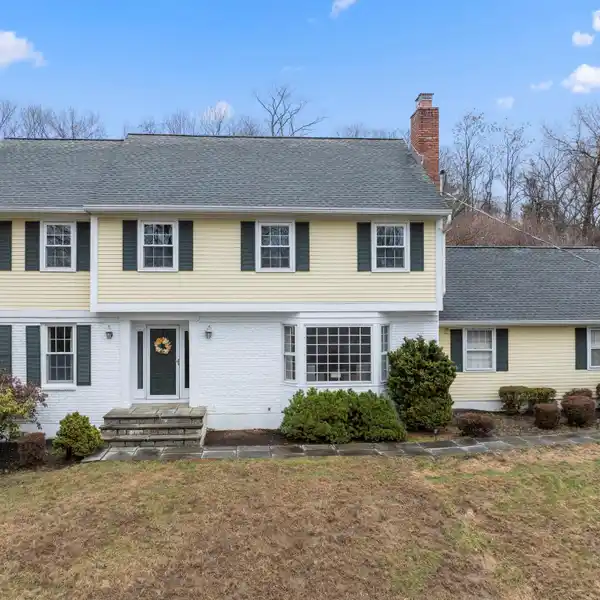 CLASSIC CENTER HALL COLONIAL IN A HILLTOP SETTING