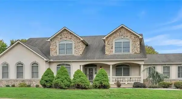 IMMACULATE CUSTOM-BUILT CAPE COD HOME