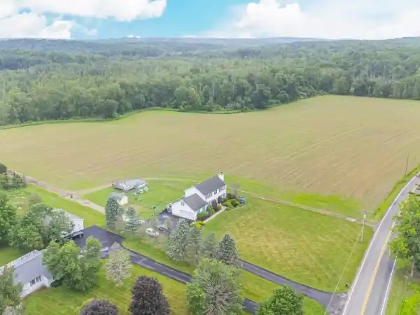 COLONIAL CHARM ON 20+ FARM-READY ACRES