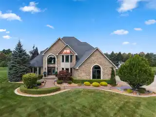 Entertainer’s Dream Home with Heated Garage, Pool & Multiple Gathering Spaces