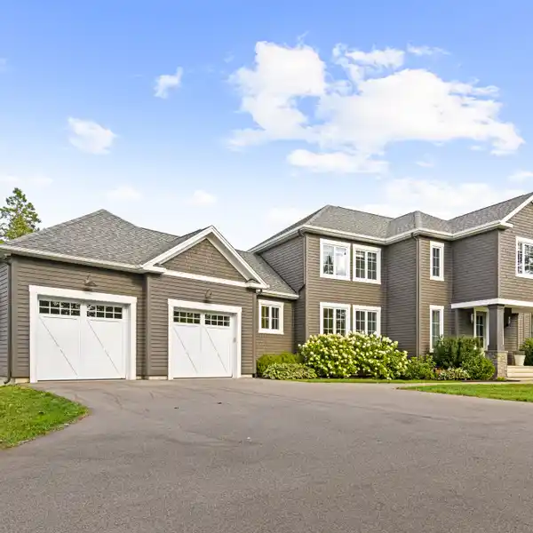 IMMACULATE CUSTOM-BUILT HOME ON A 1.78 ACRE PRIVATE WOODED LOT