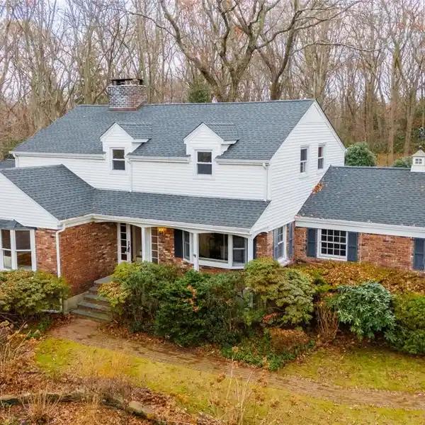 METICULOUSLY MAINTAINED RETREAT ON TWO WOODED ACRES