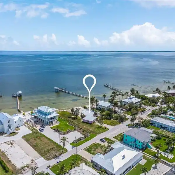 EXCEPTIONAL NEARLY HALF-ACRE BEACH FRONT LOT