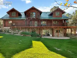 Secluded Log Estate with Waterfall Serenity