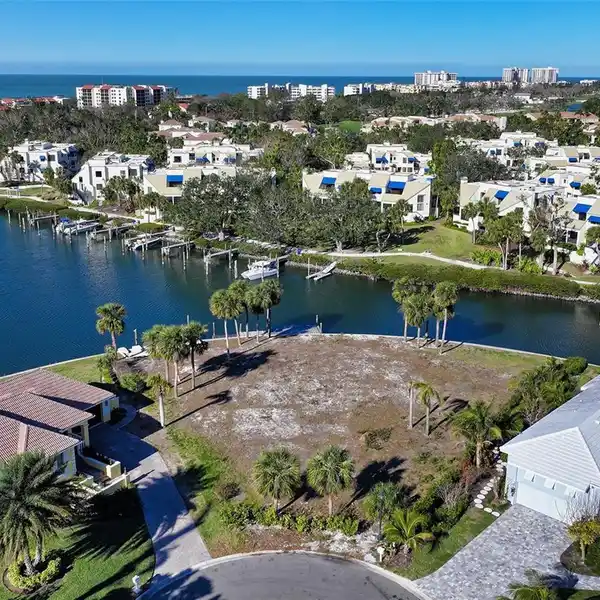 OVERSIZED WATERFRONT LOT IN EXCLUSIVE BAY ISLES HARBOR