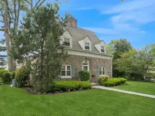 Surprisingly Spacious Stone and Brick Center-hall Colonial