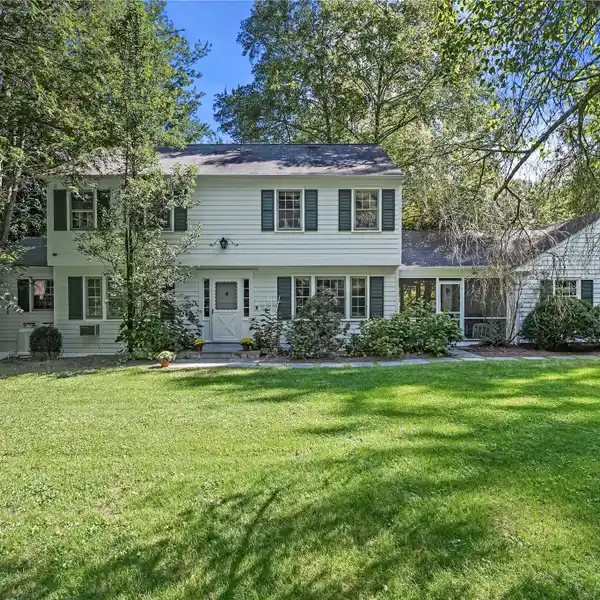 CLASSIC CENTER HALL COLONIAL ON THREE-PLUS ACRES