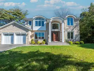 Distinguished Brick Colonial Flooded with Natural Light