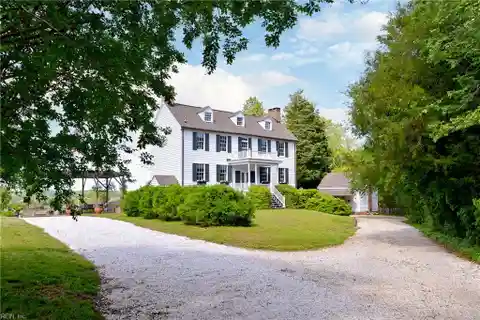 Timeless Waterfront Estate with Saltwater Pool