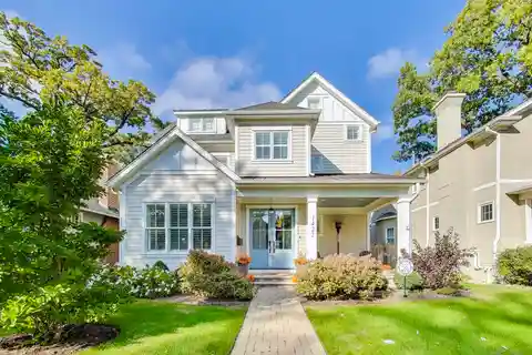 Welcoming Front Porch with Stunning Blue Double Doors