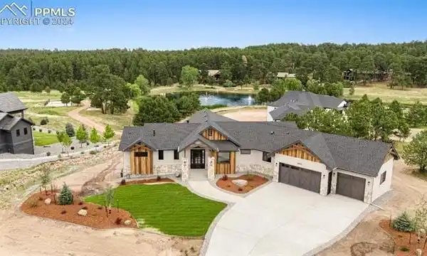 EXQUISITE MODERN RETREAT ON PREMIER POND-SIDE 1-ACRE LOT