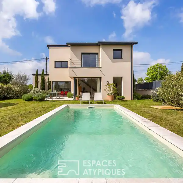 CONTEMPORARY HOME ON A BEAUTIFUL LOT WITH POOL