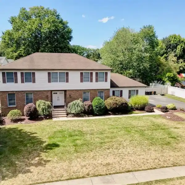 BLACK OAK ESTATES GEM WITH FOUR BEDROOMS AND SUNROOM