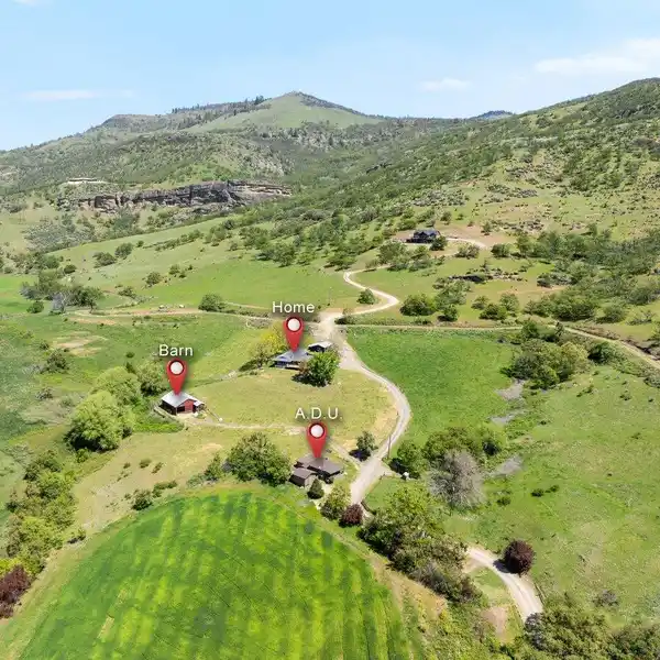 58-PLUS ACRES WITH TWO HOMES