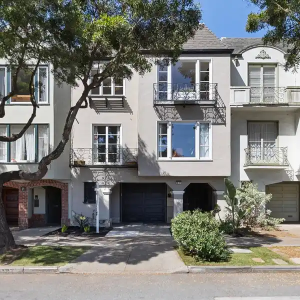 TOP-FLOOR CONDOMINIUM IN COVETED NORTH-OF-LAKE