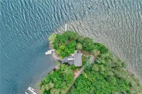 Iconic Round Lake Home with Exceptional Privacy