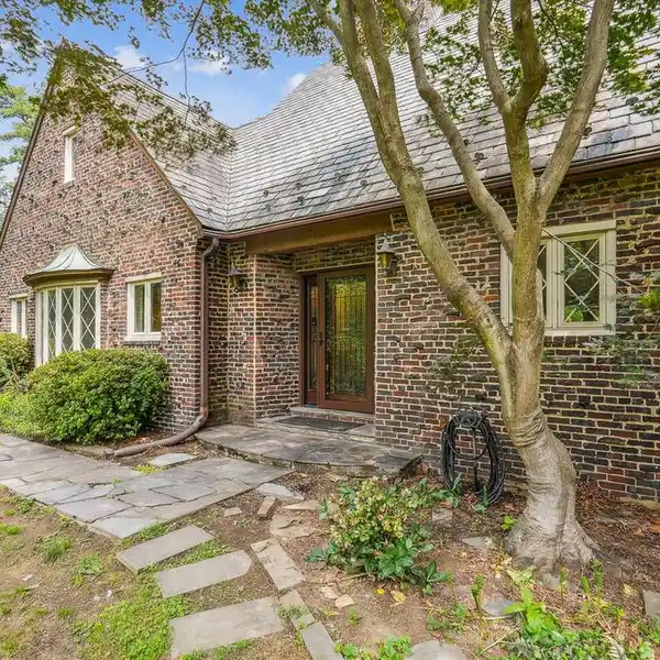 STORYBOOK TUDOR ON A LARGE CORNER LOT