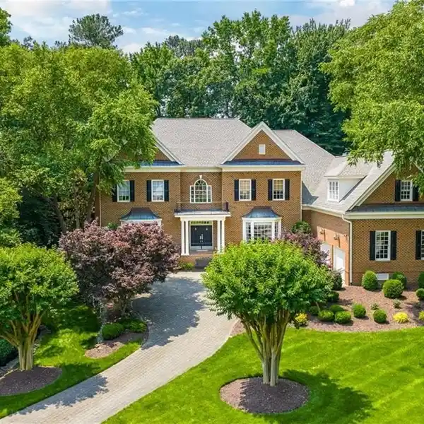 STATELY GOLF-FRONT BRICK HOME