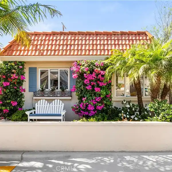 MID-CENTURY COASTAL GEM WITH COURTYARD CHARM