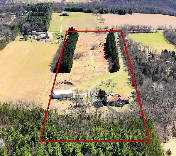 EXPANSIVE CUSTOM HOME ON NEARLY 12 ACRES