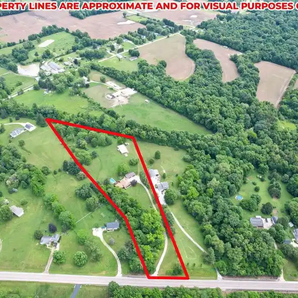 COMFORTABLE HOME ON SIX ACRES OF IMPECCABLY KEPT PARK LIKE LAND