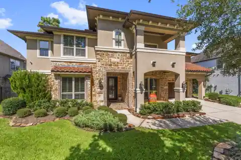 Elegant Tomball Home with Soaring Ceilings, Media Room & Pool