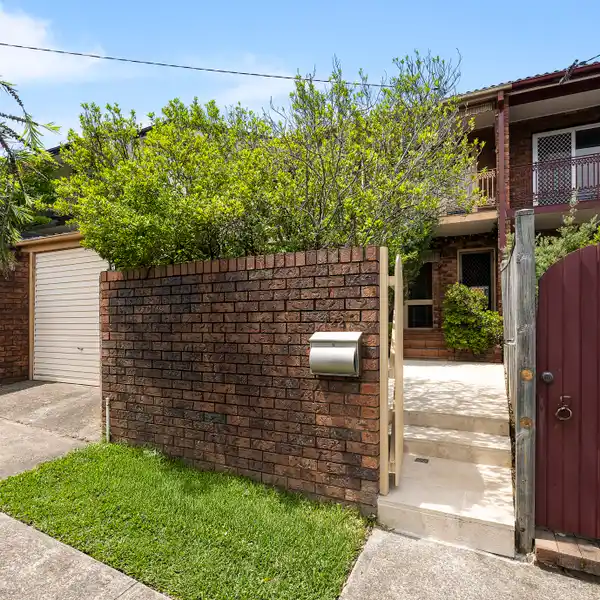 STYLISH DOUBLE-BRICK FAMILY HOME WITH SUN-FILLED COURTYARD